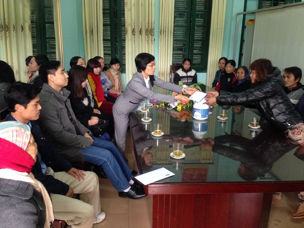 Distribution of “Chung cake” for the children at the Soc Son School for Disabled Children